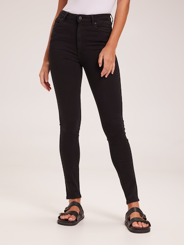 A High Rise Skinny Jean In Black Magic                                                                                          